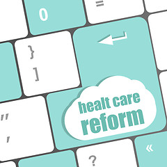 Image showing cloud icon with health care reform word on computer keyboard key