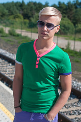 Image showing Handsome man with sun glasses on platform