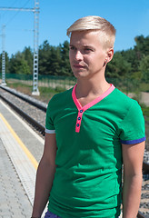 Image showing Handsome man standing on platform