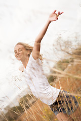 Image showing young happy attractive woman arms wide open 