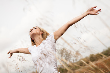 Image showing young happy attractive woman arms wide open 