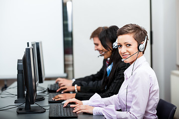 Image showing smiling callcenter agent with headset support