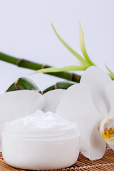 Image showing cosmetic face cream on wooden background 