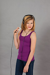 Image showing dancing happy teenager girl listening to music 
