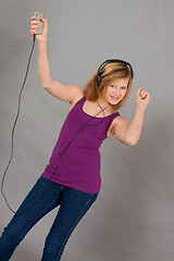 Image showing dancing happy teenager girl listening to music 