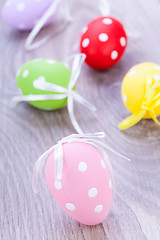 Image showing colorful easter egg decoration on wooden background