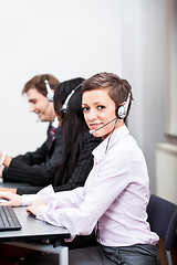 Image showing smiling callcenter agent with headset support