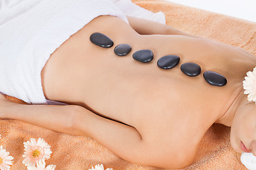 Image showing attractive healthy caucasian woman hot stone massage wellness 