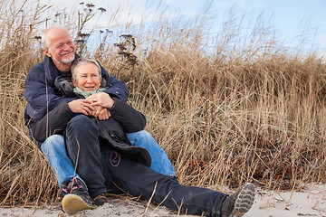 Image showing happy mature couple relaxing baltic sea dunes 