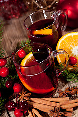 Image showing hot tasty spicy mulled red wine with orange and cinnamon christmas 