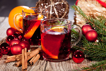 Image showing hot tasty spicy mulled red wine with orange and cinnamon christmas 