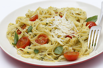 Image showing Tagliatelle with pesto tomatoes and fork