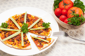 Image showing Turkish beef pizza with cucumber on top