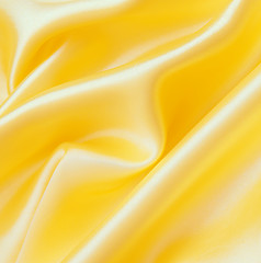 Image showing Smooth elegant golden silk as background