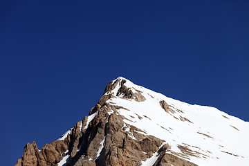 Image showing Mountain top with snow and cloudless blue sky in nice day