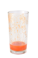 Image showing Half full tomato juice glass isolated on white background 