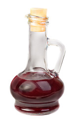 Image showing Small decanter with red wine vinegar isolated on the white 