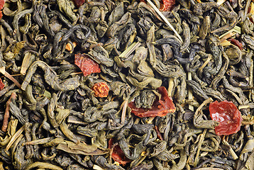 Image showing green tea with  lemon peels flower petals and lime  flavour as background