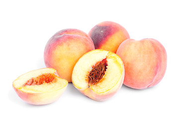 Image showing whole and sliced peach isolation on white 