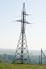 Image showing Electricity pylons  and  blue  sky  background