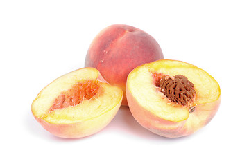 Image showing whole and sliced peach isolation on white 