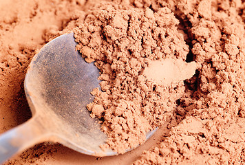 Image showing Cocoa  powder  and  steel  spoon