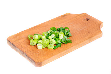 Image showing fresh sliced onions on cutting board isolated on white 