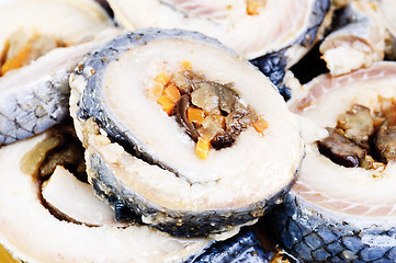 Image showing korean rolls on slices of salt  herring  