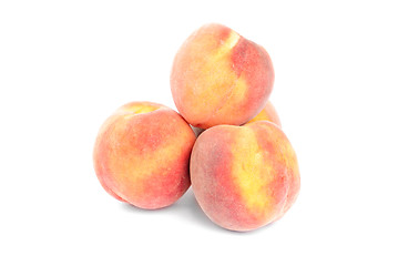 Image showing peaches isolated   on a  white  background