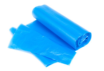 Image showing roll of blue garbage bags on a white background 