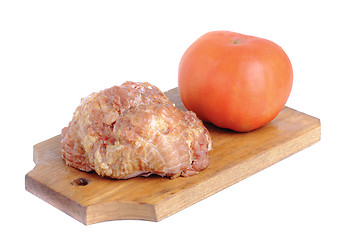 Image showing Meat product.and tomato   on a cutting board on white 