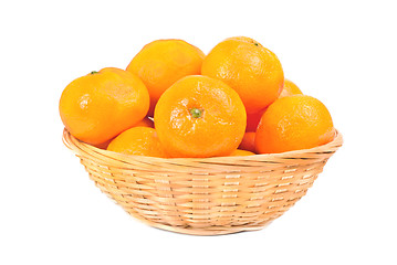 Image showing fresh mandarines in  dishes for fruit  over white background