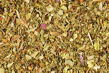 Image showing Pile of ground dried Basil (Sweet Basil) as background. Used as a spice in culinary herb all over the world. The plant is also used in medicine. 