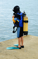 Image showing Little scuba diver , before diving into  sea