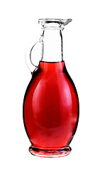 Image showing Small decanter with red wine vinegar isolated on the white 