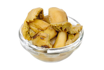 Image showing  pickled mushrooms in glass bowl  isolated on  white