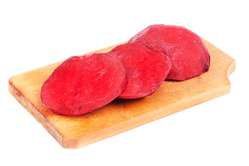 Image showing Beet purple vegetable sliced on  cutting board isolated on white background 