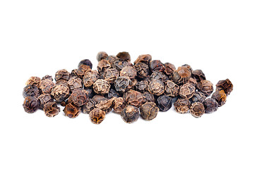 Image showing black pepper macro as isolation on white background 