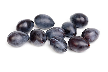 Image showing Some fresh blue plums on the white background 