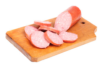 Image showing salami sausage sliced on  cutting board isolated  on  white  
