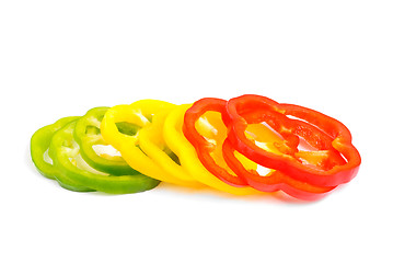 Image showing red, green and yellow sliced pepper isolated on white background