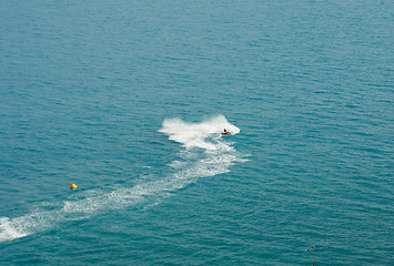 Image showing white  trace  water motorcycles on blue sea surface 