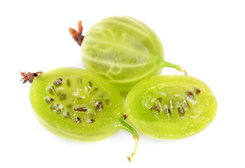 Image showing Whole and sliced green gooseberry fruit closeup with seed on white background 