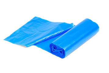 Image showing roll of blue garbage bags on a white background 