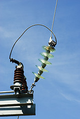 Image showing Insulators on a high voltage electric pillar   jn the  blue sky background