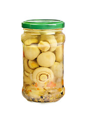 Image showing Marinated mushrooms in the glass jar isolated on white
