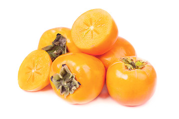Image showing Persimmon fruit whole and sliced on white background