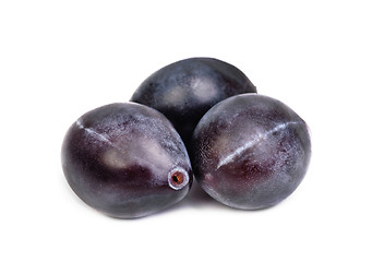 Image showing Three fresh blue plums on the white background 