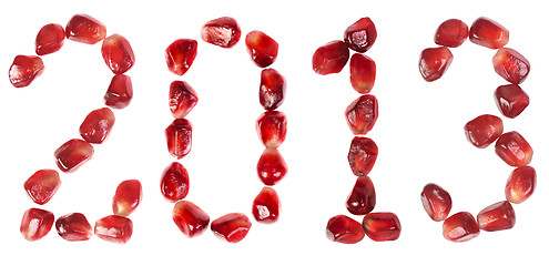 Image showing Happy new year 2013. Word of 2013 from the seeds of a pomegranate isolated on white 