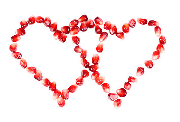 Image showing pomegranate seeds as heart shaped  isolated  on  white